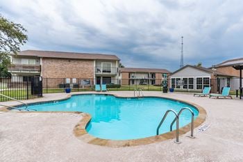 Swimming pool with lounge chairs and clubhouse